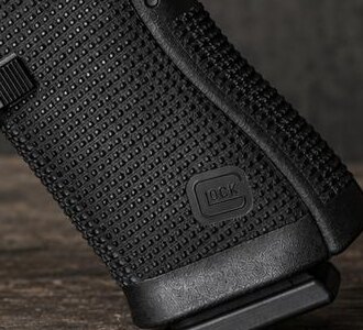 Grip stippling and magazine well